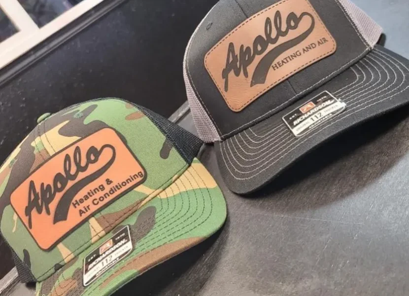 2 hats with logos on them